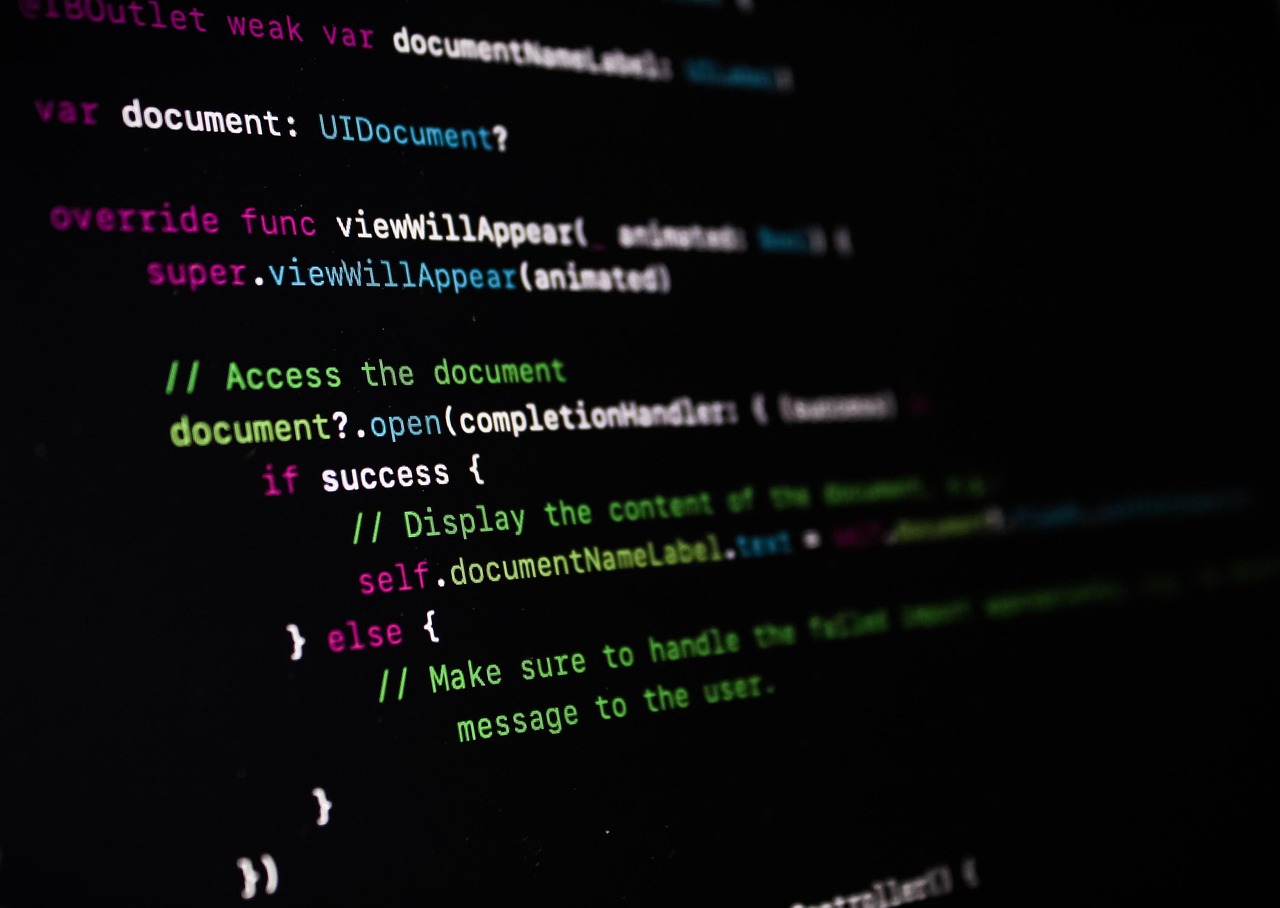 Website code displayed on a monitor